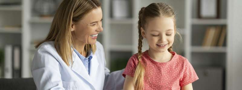 Dyslexia Treatment. Pediatric Neurologist Lady Having Therapy Session With Cute Little Girl